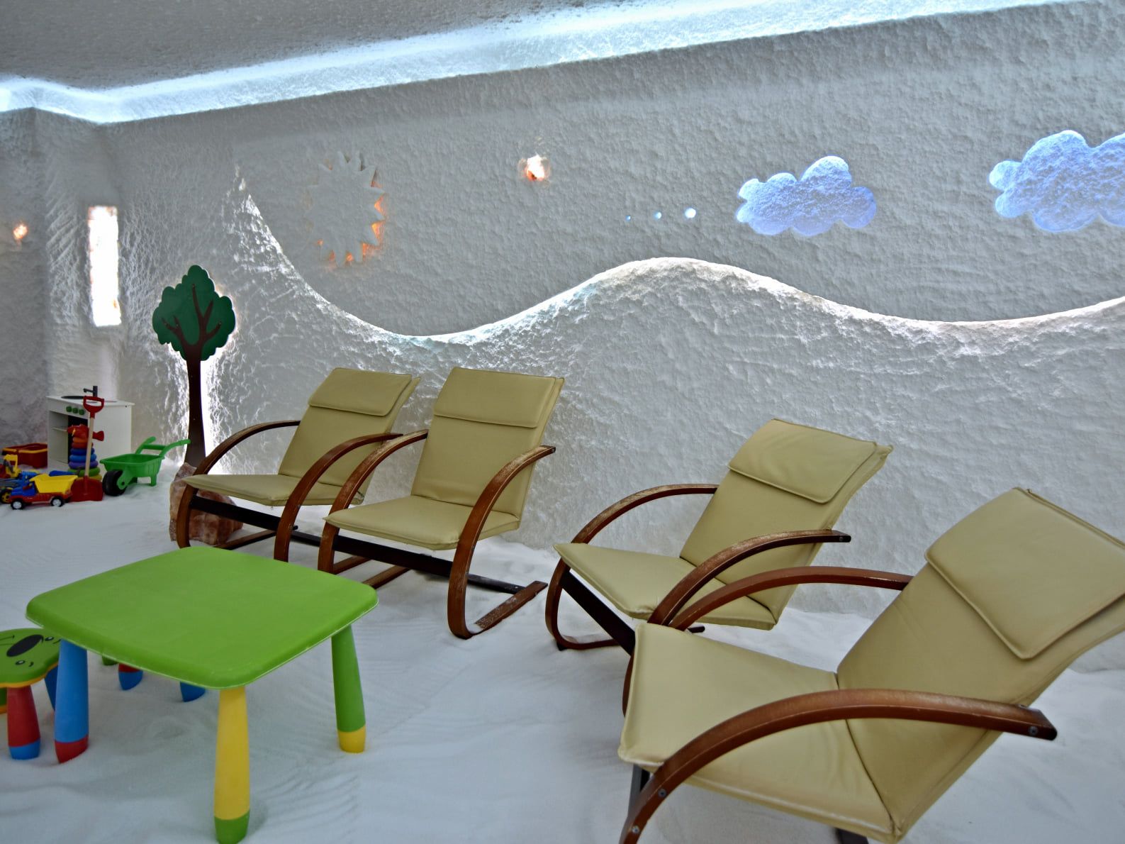 A salt room with loungers and sculpted salt walls